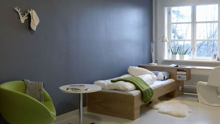 Blue Background And Wooden Bed In Room